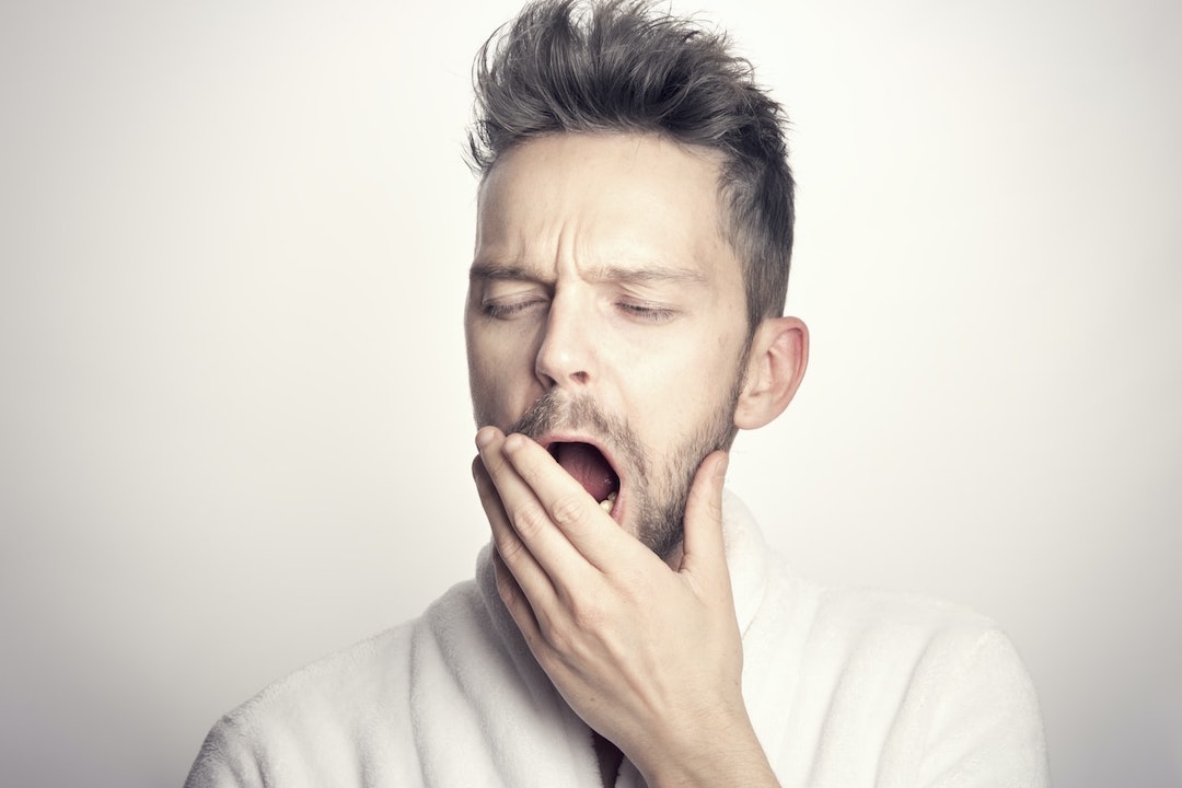 sleepy-person-photo-1618517047922-d18a5a36c109